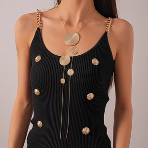 Modern gold long sweater necklace with multiple round textured pendants on a black top