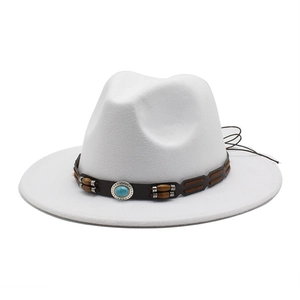 Detail of white wide brim fedora with turquoise and wood bead bohemian leather band