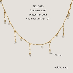 Detail showing 18k gold plated stainless steel necklace with small round zircon pendants