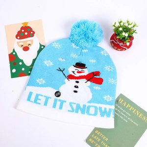 Close-up of LED knit Christmas hat featuring blue snowman pattern and ON/OFF switch