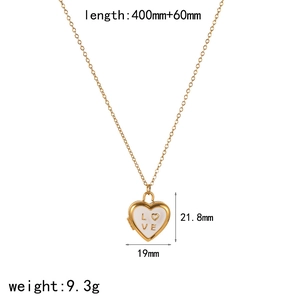 Detail view of gold heart locket necklace with LOVE engraving and sizing dimensions