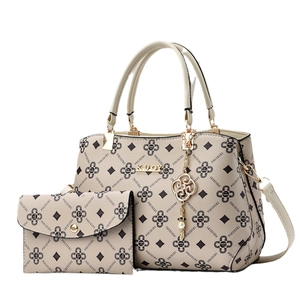 Chic beige monogram tote bag and matching wallet set with elegant gold hardware