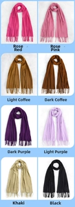 Multiple solid colors of faux cashmere scarves with fringe displayed in a grid view