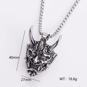 Macro shot of retro stainless steel demon eye pendant with detailed 3D carving