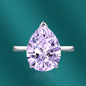 Macro view of pear-cut lavender gemstone set in a minimalist silver adjustable ring