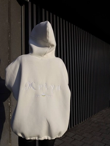 Detail of white oversize hoodie featuring intricate Mriya embroidery on back