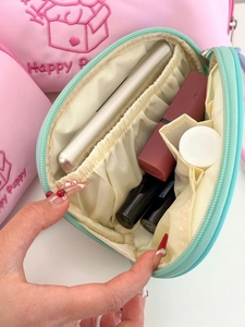 Internal view of mint green puppy makeup bag with elastic dividers and large capacity