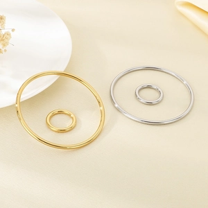 Polished 18k gold and silver stainless steel minimalist rings in varied sizes