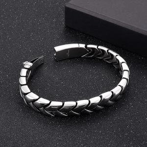 Detailed macro view of silver 316L stainless steel bracelet with heavy wheat chain design