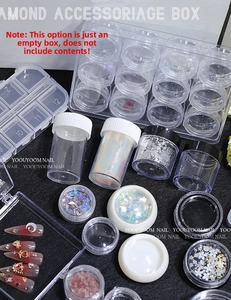 Macro view of transparent nail art organizer with 28 individual storage slots for beads