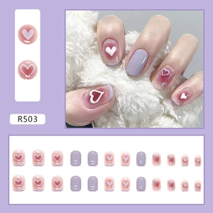 Short round lilac press-on nails set with 24 pieces featuring white 3D heart designs