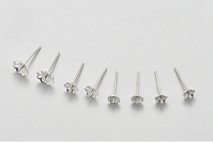 Macro shot of assorted S925 sterling silver plum blossom earring posts and DIY craft bases