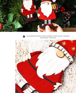 Detail of painted wooden Christmas gnome ornaments with red and grey festive colors