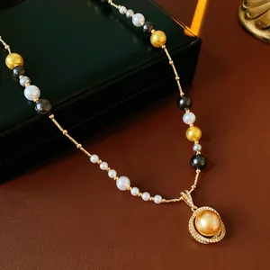 French vintage style pearl necklace with gold, black, white pearls and zircon pendant