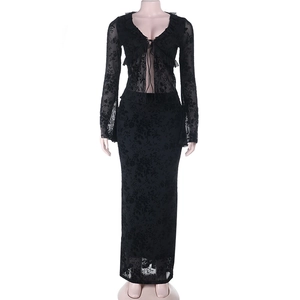 Detail of black floral lace fabric on long sleeve top and slim midi skirt set