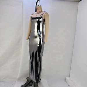 Detailed view of silver metallic dress fabric and thin shoulder strap construction