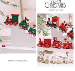 Detail view of wooden Christmas train ornaments with bear and snowman figures