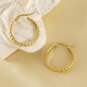 Textured 18K gold-plated titanium steel hoop earrings on elegant silk and marble background