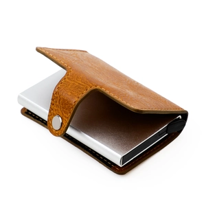 Detail of RFID blocking brown leather wallet with silver aluminum automatic card ejector
