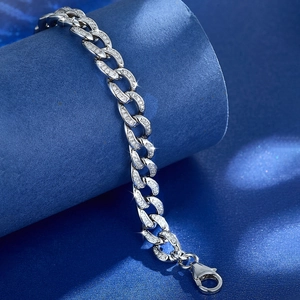 Macro shot of silver S925 sterling silver hollow chain bracelet with full zircon inlays
