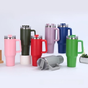 Row of colorful 40oz insulated tumblers with handles and straws for car cup holders