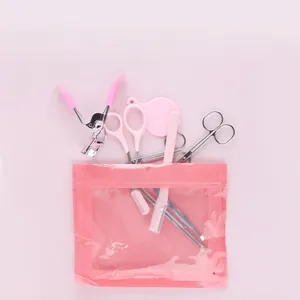 Pink 6-piece eyebrow grooming and eyelash curler set with a clear PVC storage bag