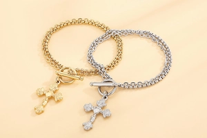 Detail of double-layer chain bracelets with OT buckle and rose carved cross pendants