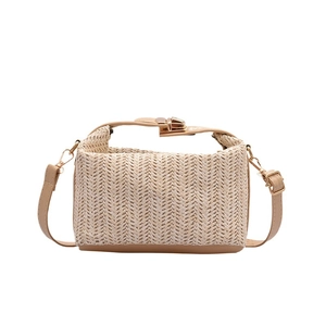 Minimalist straw woven crossbody bag for women featuring golden hardware and PU strap