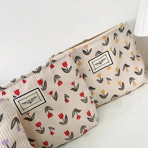Corduroy makeup bags with tulip floral patterns and zipper closure in three colors