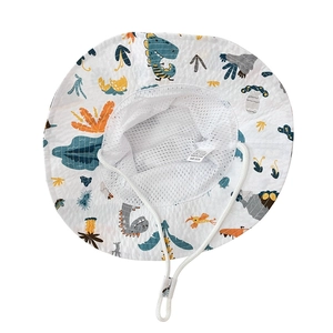 Detail view of children's cotton sun hat featuring breathable mesh lining and dinosaur print