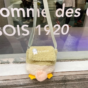 Cute lamb wool duck bag with green flap, astronaut rabbit badge and plush details