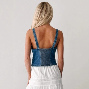 Women's blue denim bustier top with smocked elastic back and adjustable thin straps