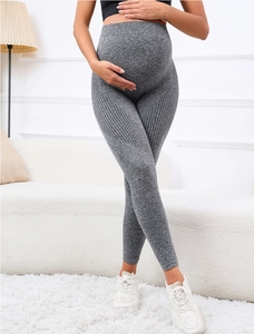 Detail of high-waisted maternity yoga pants in heather grey with seamless texture