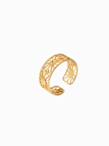 Macro shot of 18k gold plated open ring featuring vintage sunburst cutout patterns