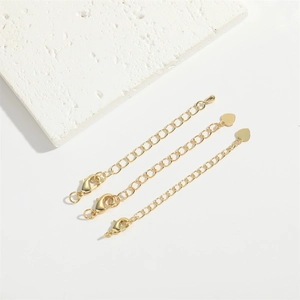Three-piece golden extension chain set with lobster clasps and heart charms on stone