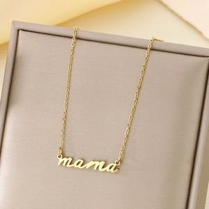 Close-up of a 18K gold-plated stainless steel necklace with a cursive mama pendant