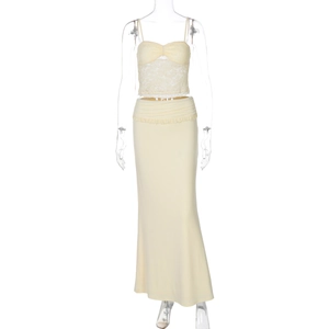 Close-up of pale yellow lace tube top and matching slim maxi skirt set for women