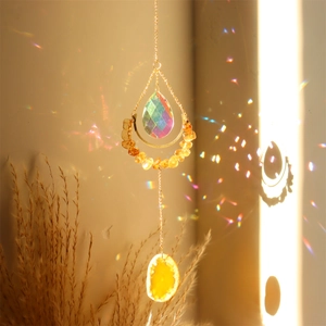 Detailed suncatcher with gold crescent moon frame, natural agate slice and crystal prism