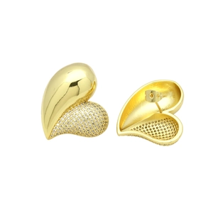 Detailed close-up of 18k gold heart earrings featuring asymmetric cubic zirconia inlay