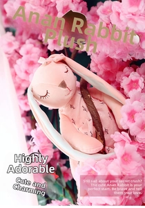 Close-up of a pink plush rabbit with closed eyes nestled among blooming cherry blossoms
