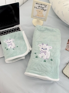 Detail of mint green coral fleece towel set with lamb embroidery and twisted rope edges