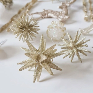 Champagne gold glitter star and reindeer Christmas tree ornaments on white background