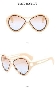Detailed side and front view of beige oversized sunglasses with tea blue gradient lenses