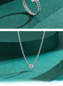 Macro detail of S925 sterling silver Cuban chain necklace with oval zircon pendant