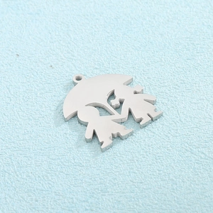Macro view of stainless steel couple kissing under umbrella heart shaped pendant