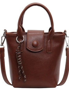 Vintage brown leather bucket bag with top handle and adjustable shoulder strap for women