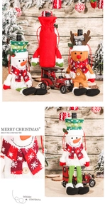 Close-up of knit Christmas wine bottle covers featuring snowman and reindeer designs