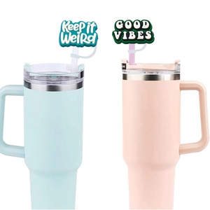 Blue and pink tumblers with Keep it Weird and Good Vibes straw covers set