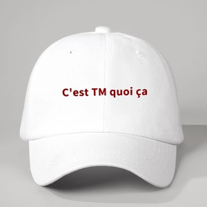 Classic white cotton baseball cap with red embroidered C'est TM quoi ça French text