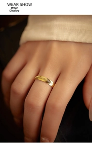 Close-up of golden S925 silver ring featuring fine concentric textured scale patterns